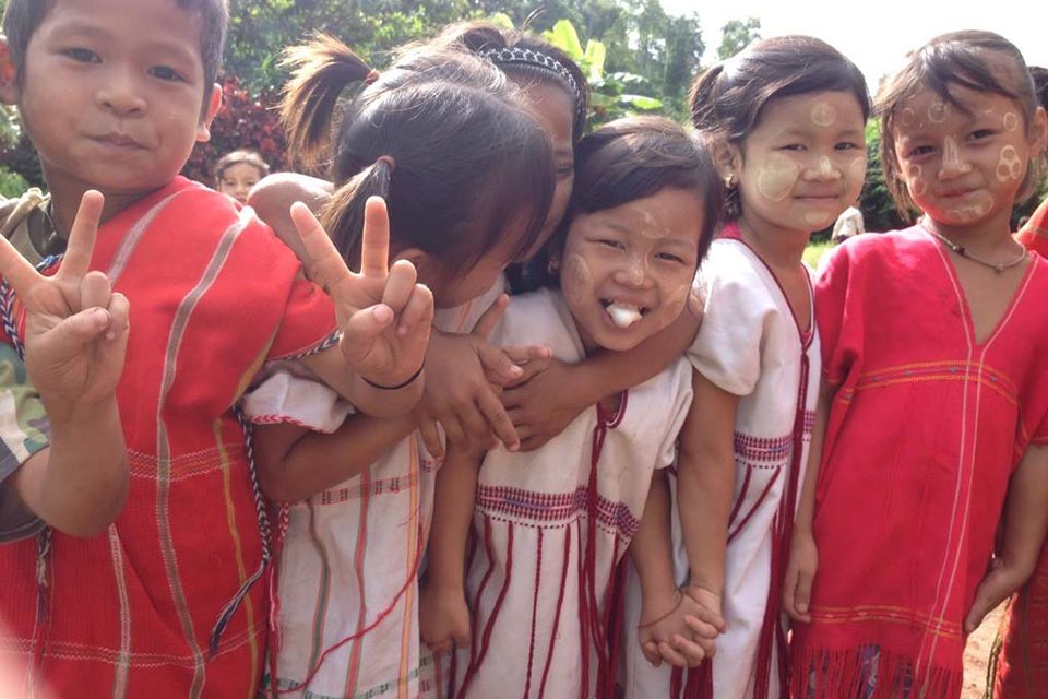 Volunteer helping Karen Burmese migrant children