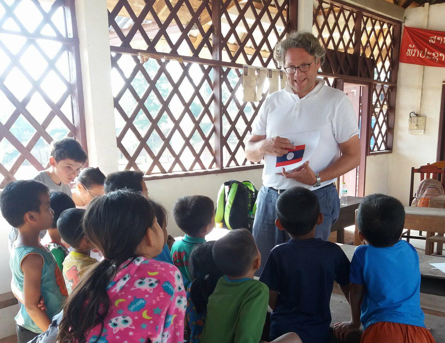volunteer-family-teaching poor kids in Laos